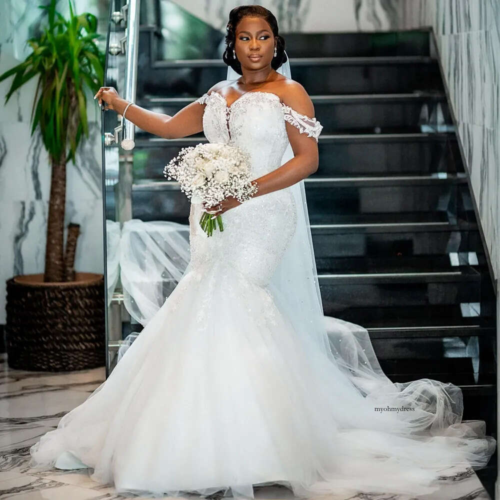 2024 Sexy Arabic Mermaid Wedding Dresses Illusion Off Shoulder Sequined Lace Appliques Crystal Beads Short Sleeves Bridal Gowns Plus Size Sweep Train 