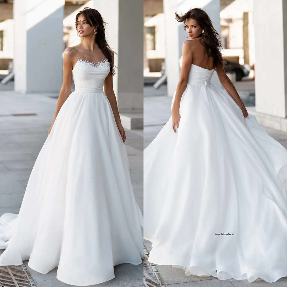 Sexy A Line Dresses For Bride Sheer Neck Pearls Sequins Sweetheart Wedding Dress Backless Long Designer Bridal Gowns Sweep Train 0515
