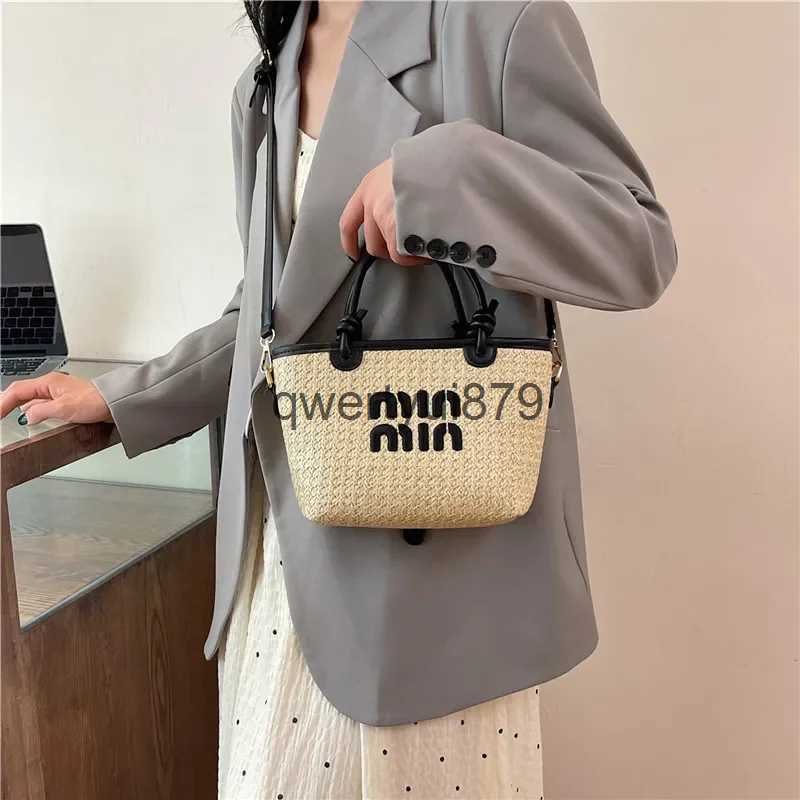 Shoulder Bags 2024 New Summer Grass Basket Womens Bohemian Beach Bag Designer Cute Wallet and Handbag H240523