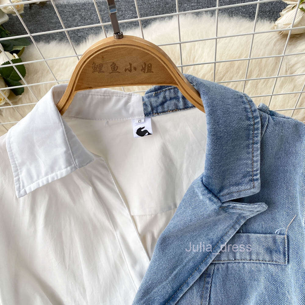2022 spring and autumn new irregular long sleeved shirt stitching cowboy temperament fried Street dress female design sense of minority