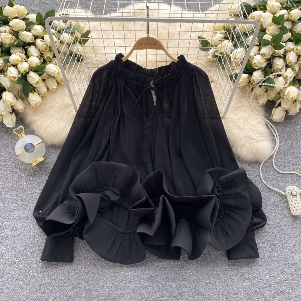 French haute couture temperament lantern long sleeved lace up loose ruffle hem shirt for womens fashionable and unique niche top