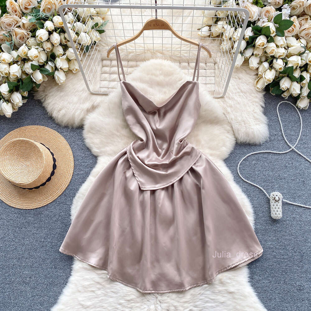 Light luxury and high-end satin dress for women with a fake design. Two slim fitting short A-line skirt and sexy suspender dress