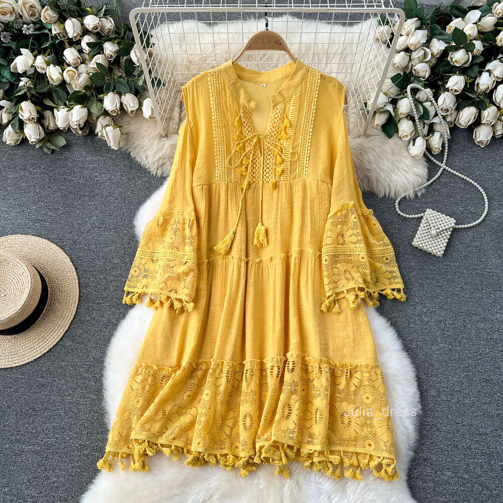 Korean style early spring vacation dress for women with a design sense of hollowed out flared sleeves tassels loose and slimming lace skirt