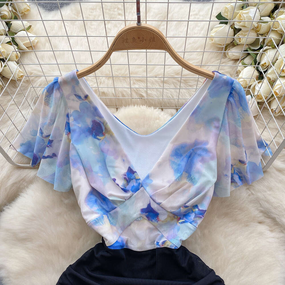 Nightclub womens sexy deep V-neck niche color blocking splicing waist tightening slimming sexy buttocks wrapped skirt small stature dress