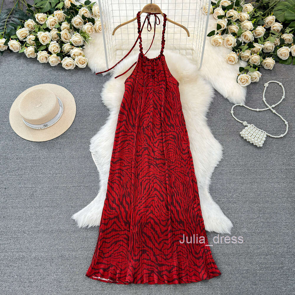 Fashionable seaside vacation neck hanging backless loose fitting mid length A-line printed dress for travel wear camisole long dress