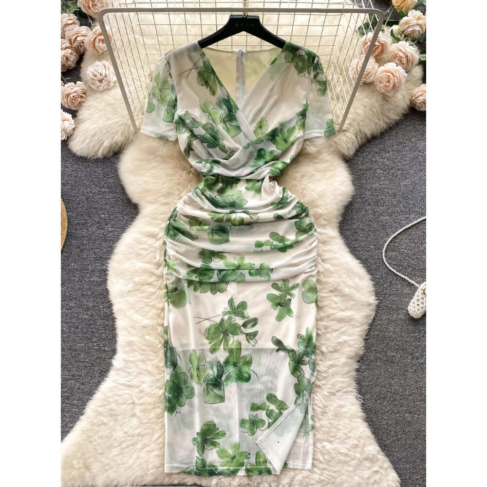 Summer new French niche pleated V-neck short sleeved printed mesh wrap hip skirt for womens slim fit and slimming dress trend