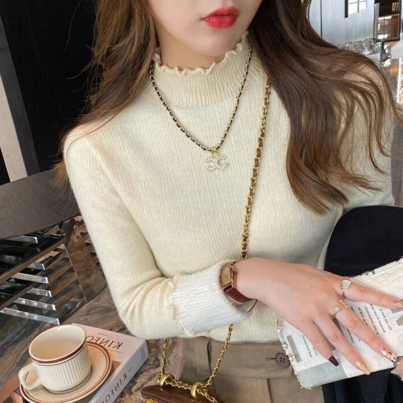 The new winter collection adds a thick one-piece velvet sweater for women, featuring a semi high collar and wooden ear lining with a stylish designer 