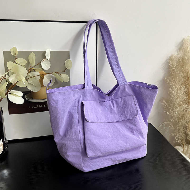 New waterproof nylon large capacity portable shoulder bag for men and women, casual travel workwear style commuting tote bag