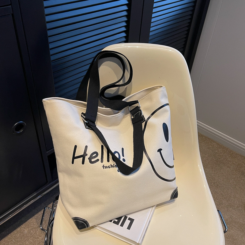 2024 new large capacity fashionable simple shoulder canvas bag Korean version New casual student smig face handbag for women