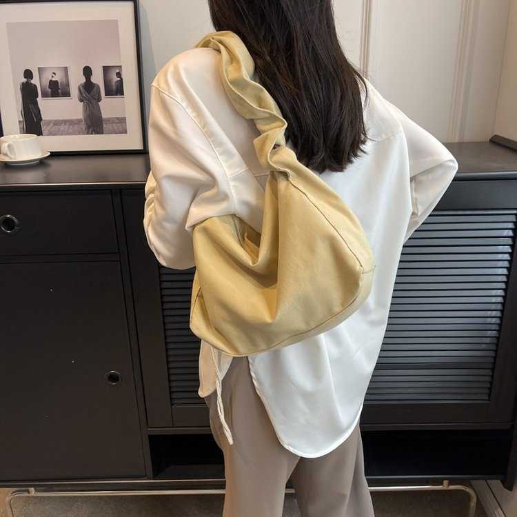 Canvas bag women's Korean version single shoulder pleated drawstring canvas bag small fresh artistic hand-held diagonal cross casual women's
