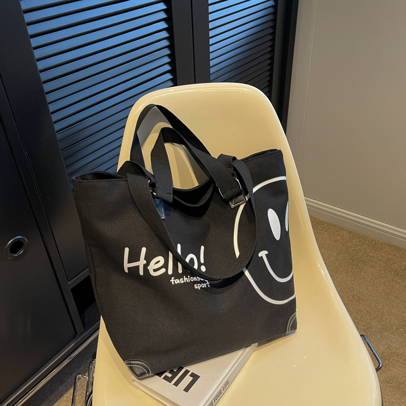 2024 new large capacity fashionable simple shoulder canvas bag Korean version New casual student smig face handbag for women