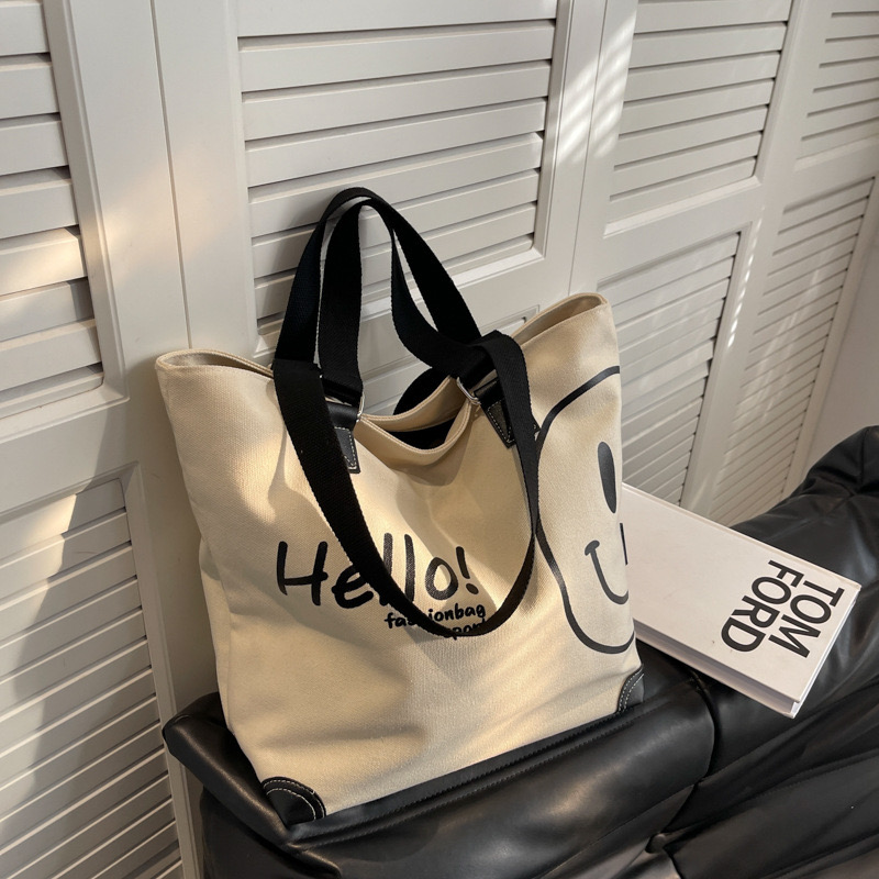 2024 new large capacity fashionable simple shoulder canvas bag Korean version New casual student smig face handbag for women