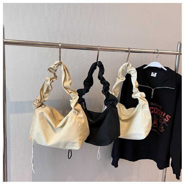 Canvas bag women's Korean version single shoulder pleated drawstring canvas bag small fresh artistic hand-held diagonal cross casual women's