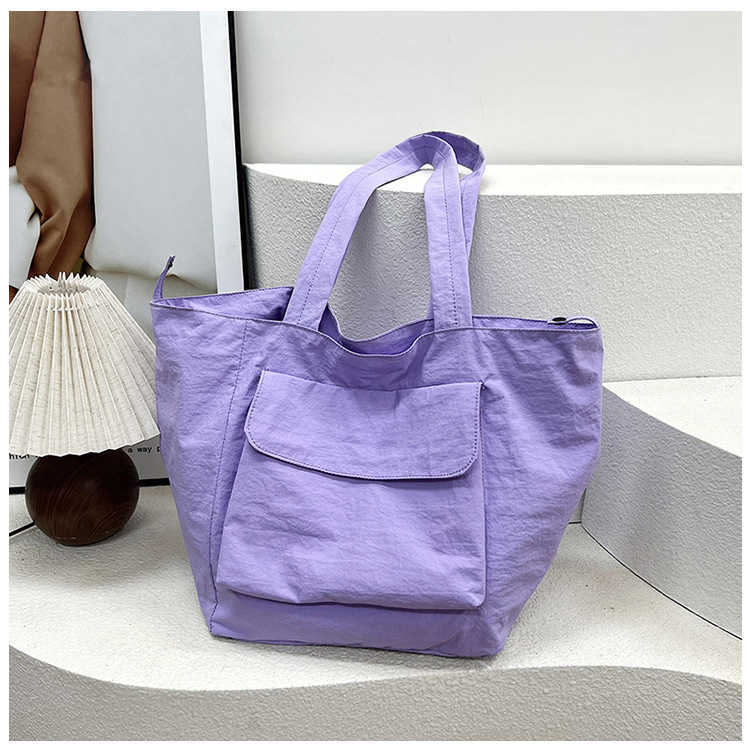 New waterproof nylon large capacity portable shoulder bag for men and women, casual travel workwear style commuting tote bag