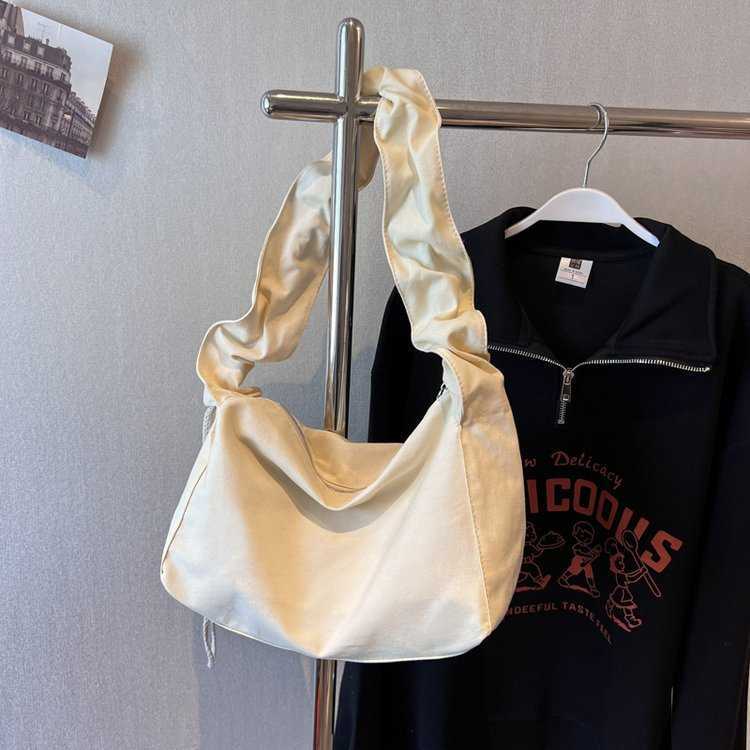Canvas bag women's Korean version single shoulder pleated drawstring canvas bag small fresh artistic hand-held diagonal cross casual women's
