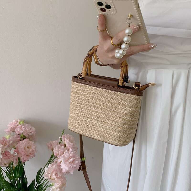 2024 summer new niche crossbody small women, high-end texture hand-held grass woven bucket bag for women