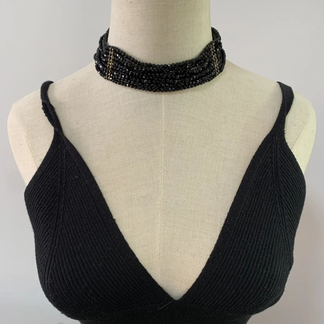 Black multi-layer glass bead necklace woven with elegant flowers paired with a skirt 241205