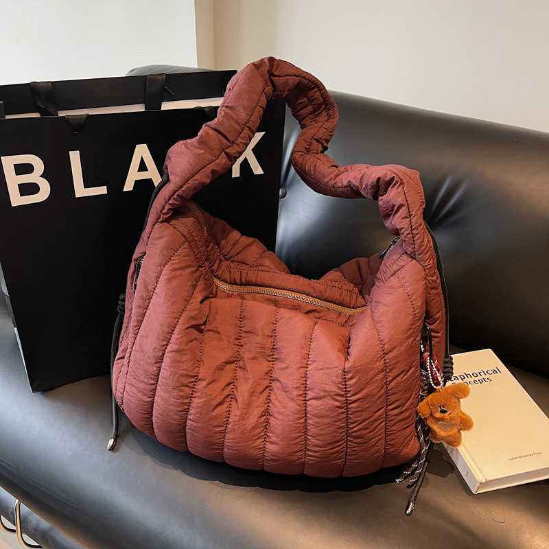 women Korean version niche trend drawstring nylon cloth bag, casual sports dumpling bag, single shoulder crossbody bag 241215