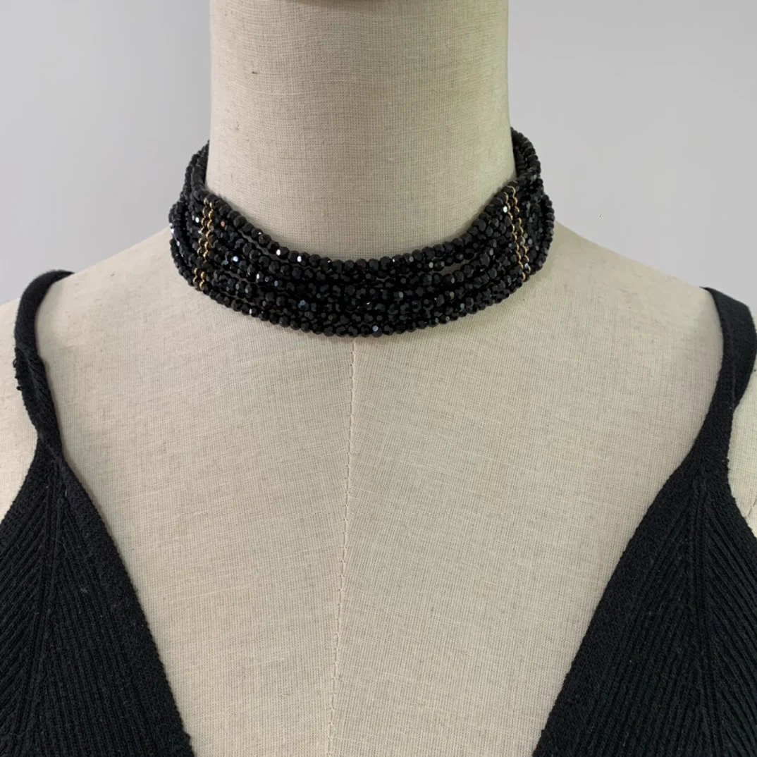 Black multi-layer glass bead necklace woven with elegant flowers paired with a skirt 241205