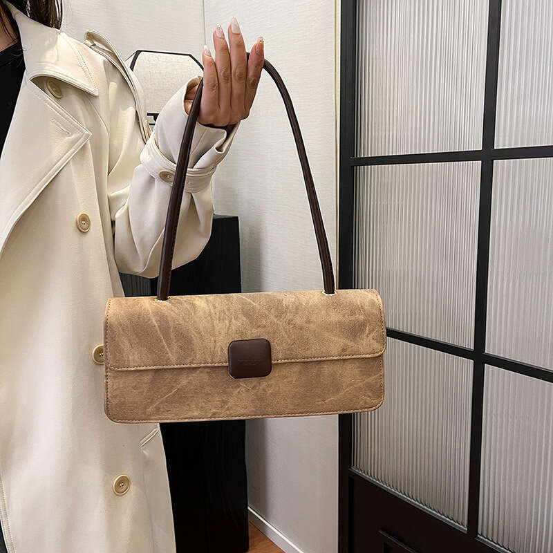 2024 autumn and winter new fashionable niche design armpit French stick versatile hand-held women's bag