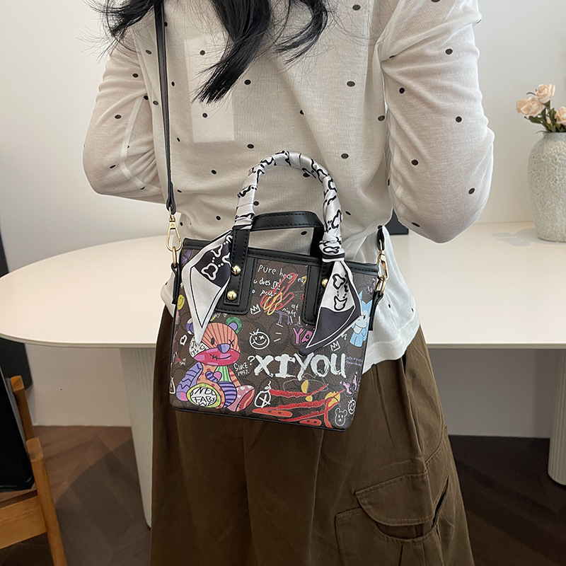 2024 Autumn New Handbag Women's Cartoon Bear Graffiti Bucket Texture Fashion Single Shoulder Crossbody Bag