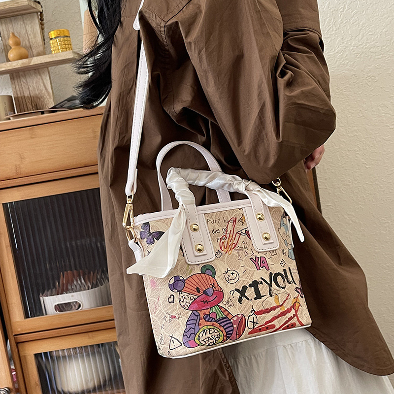 2024 Autumn New Handbag Women's Cartoon Bear Graffiti Bucket Texture Fashion Single Shoulder Crossbody Bag