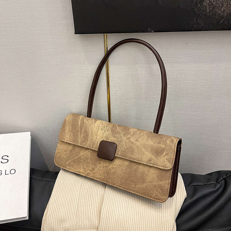 2024 autumn and winter new fashionable niche design armpit French stick versatile hand-held women's bag