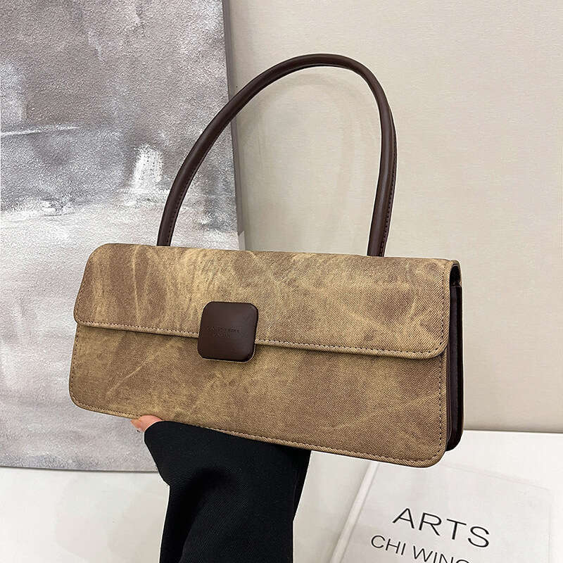 2024 autumn and winter new fashionable niche design armpit French stick versatile hand-held women's bag