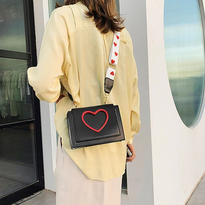 Womens Sweet and Cute Cross shaped Bag Heart shaped Hollow Shoulder Bag Student Full Match Flip Wide Shoulder Strap Summer Handbag Ins Fashion Wallet 