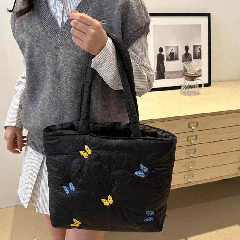Butterfly shoulder bag large capacity handbag womens commuting leisure down cotton pad lower arm shoulder 241205