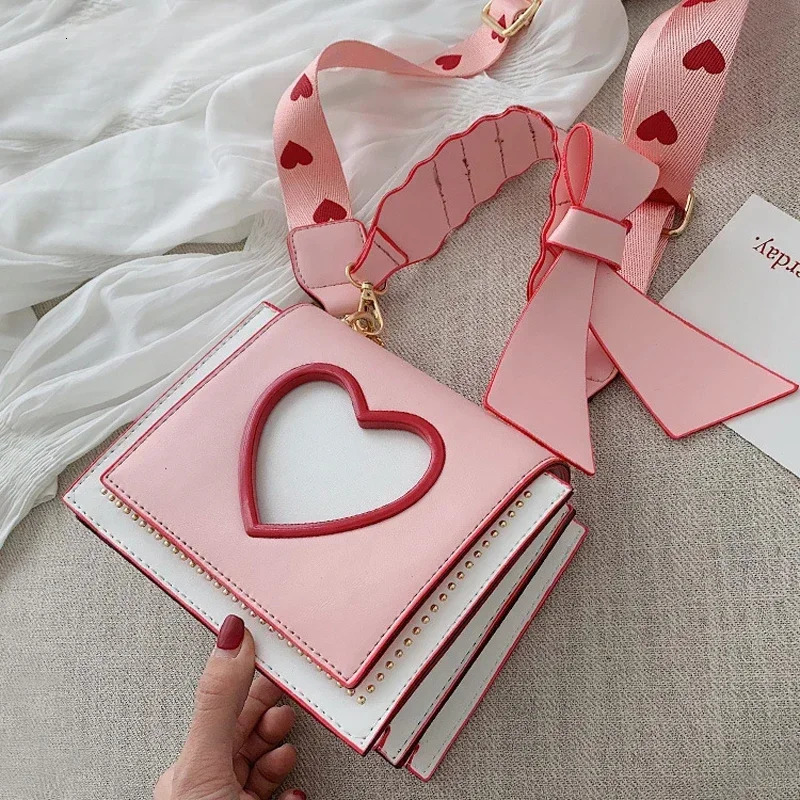 Womens Sweet and Cute Cross shaped Bag Heart shaped Hollow Shoulder Bag Student Full Match Flip Wide Shoulder Strap Summer Handbag Ins Fashion Wallet 