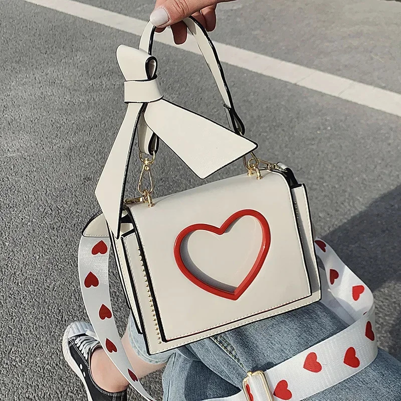 Womens Sweet and Cute Cross shaped Bag Heart shaped Hollow Shoulder Bag Student Full Match Flip Wide Shoulder Strap Summer Handbag Ins Fashion Wallet 