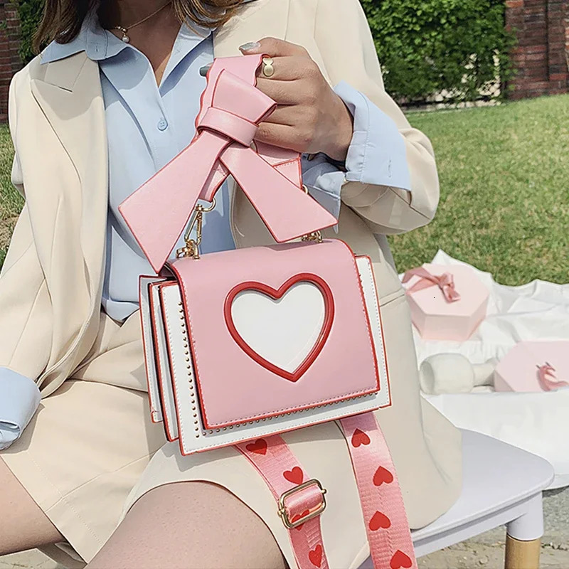 Womens Sweet and Cute Cross shaped Bag Heart shaped Hollow Shoulder Bag Student Full Match Flip Wide Shoulder Strap Summer Handbag Ins Fashion Wallet 