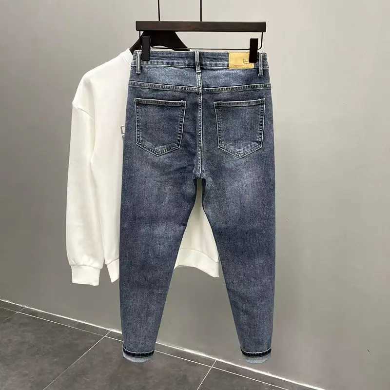 High Quality Newly arrived fashionable mens jeans with spliced cat whiskers torn and scratched luxurious clothing ultrathin fit tapered legs designer 