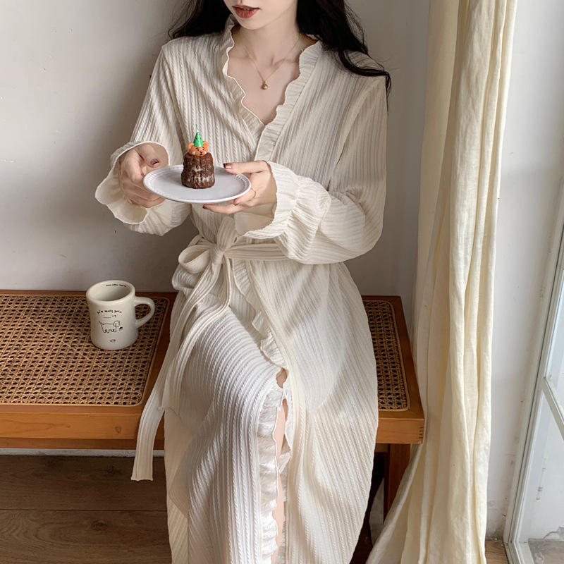 2025 Designer s new women s black wood ear fashion nightgown autumn and winter fairy style simple solid color suspender bathrobe medium to long loose 