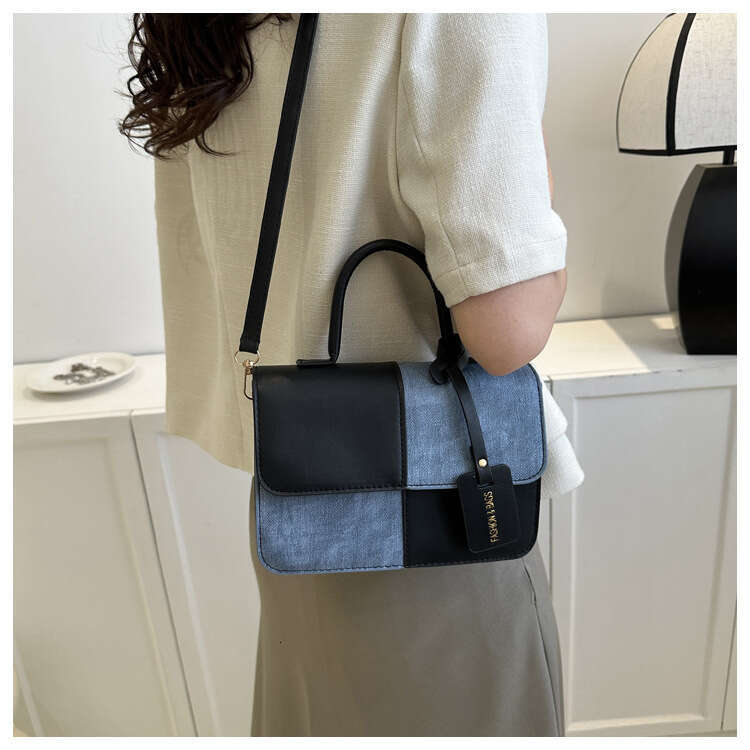 Niche design color blocking splicing hand-held small square 2023 new texture crossbody fashion shoulder bag