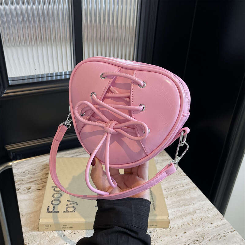 High appearance niche design girl's heart ballet single shoulder crossbody bag, bow tie strap, heart-shaped handbag