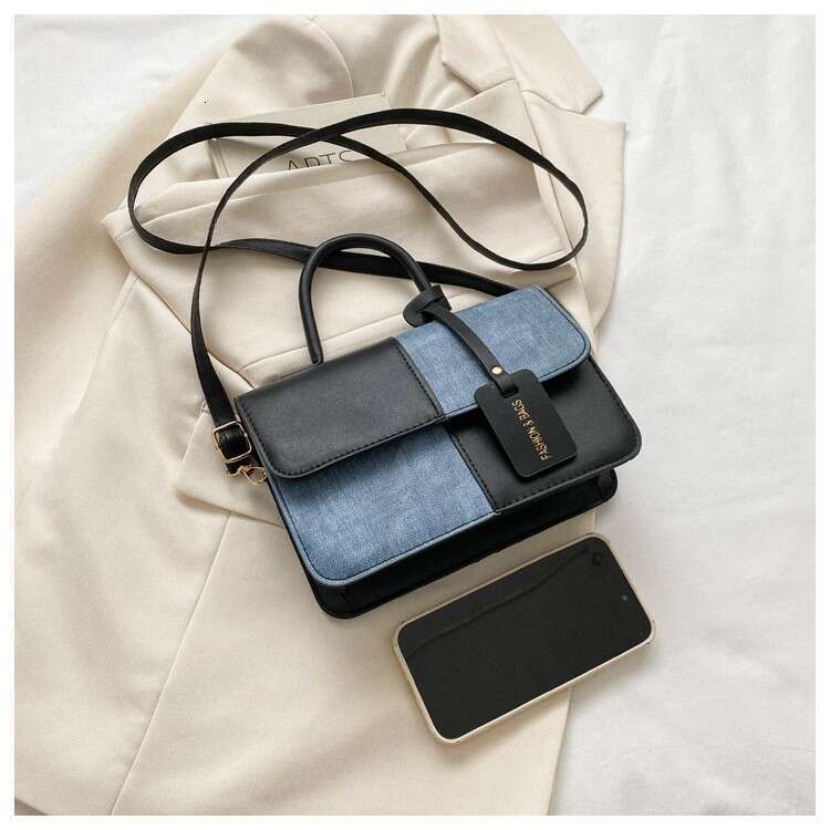 Niche design color blocking splicing hand-held small square 2023 new texture crossbody fashion shoulder bag