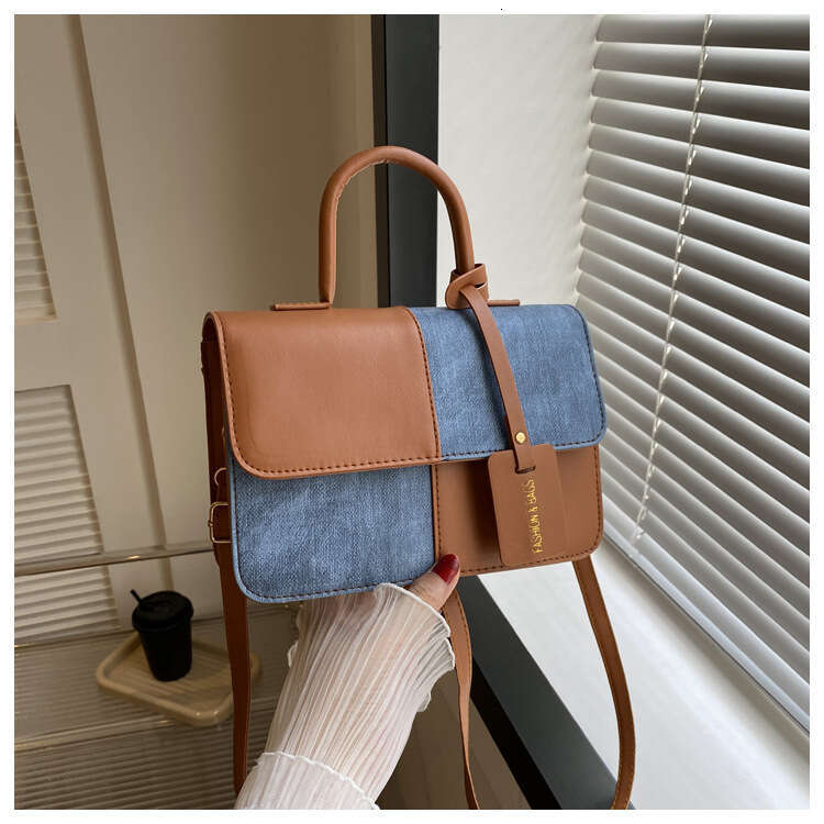 Niche design color blocking splicing hand-held small square 2023 new texture crossbody fashion shoulder bag