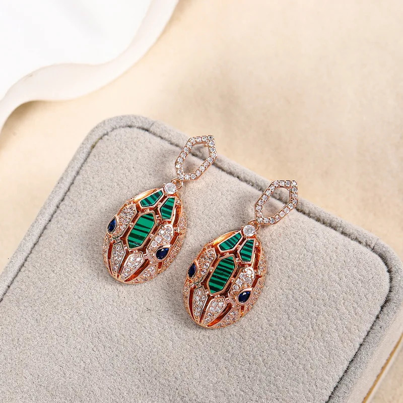 European and American er earrings for women set with cubic zirconia peacock stone gold-plated 925 silver needle snake earrings 241209