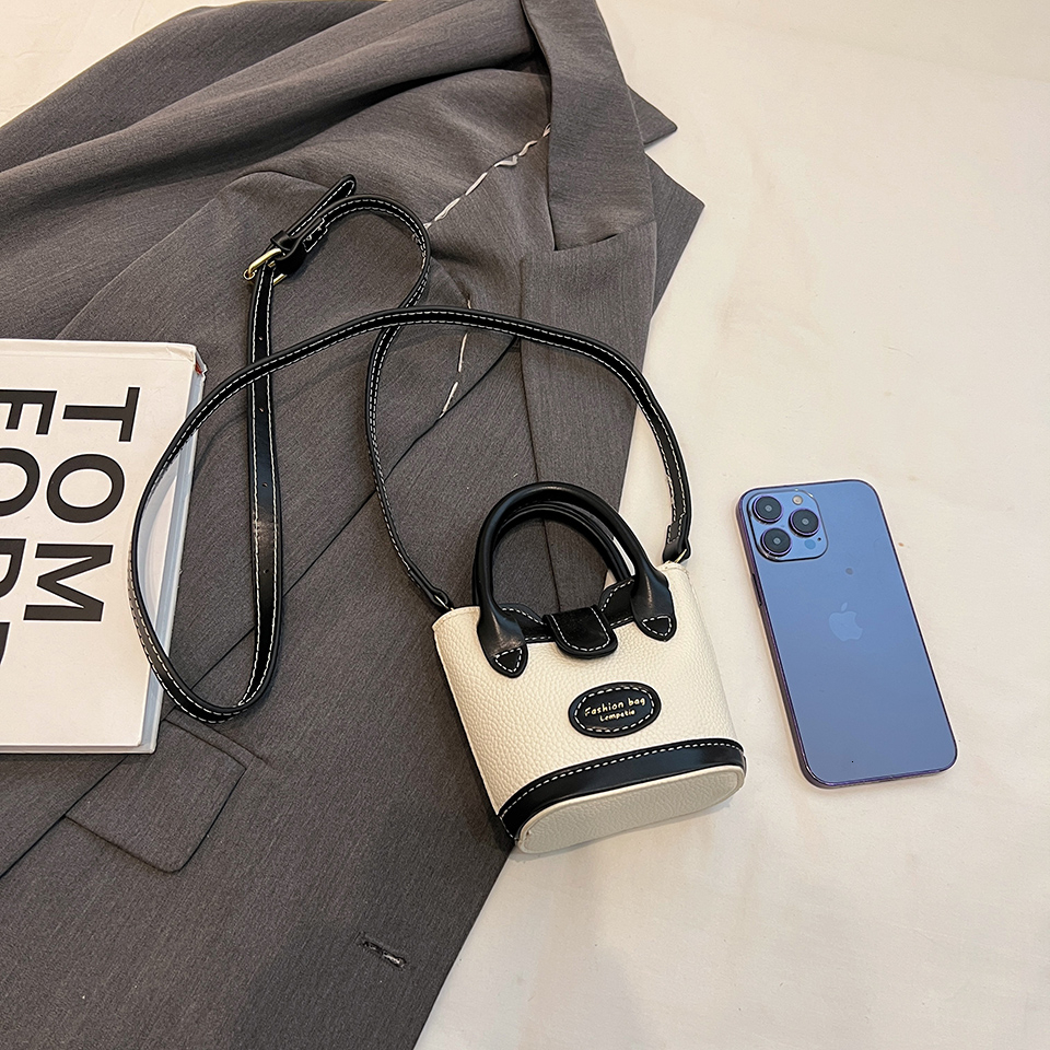 A new cute trend and exquisite soft trend designer PU handbag suitable for daily necessities such as lipstick phone buttons etc