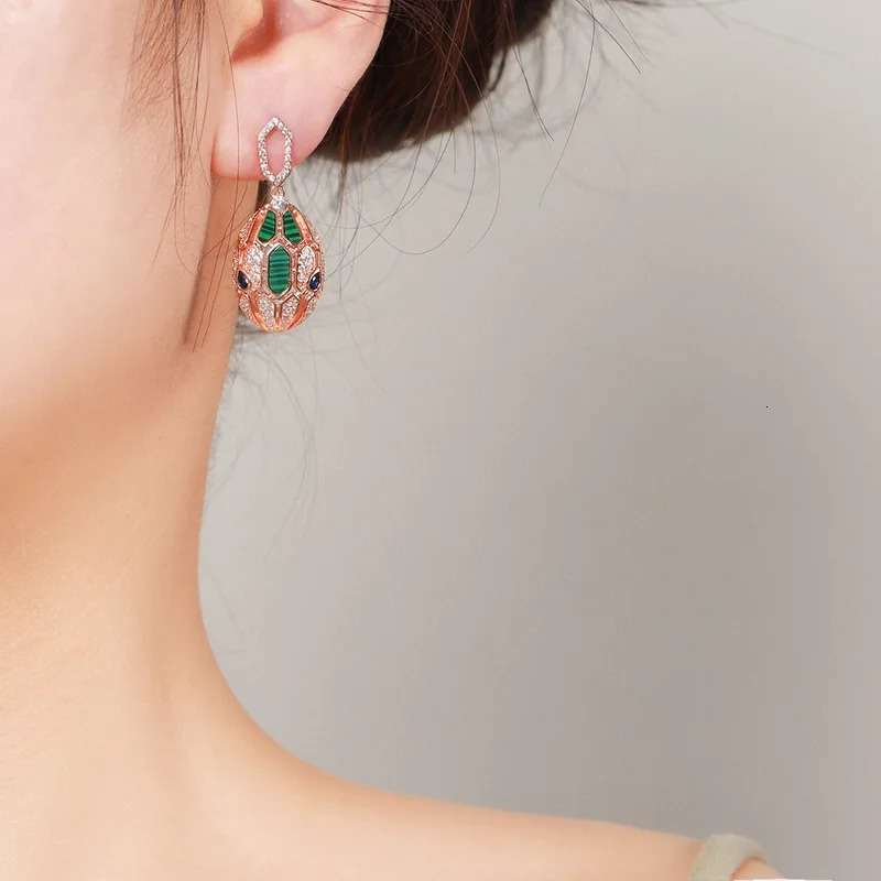 European and American er earrings for women set with cubic zirconia peacock stone gold-plated 925 silver needle snake earrings 241209