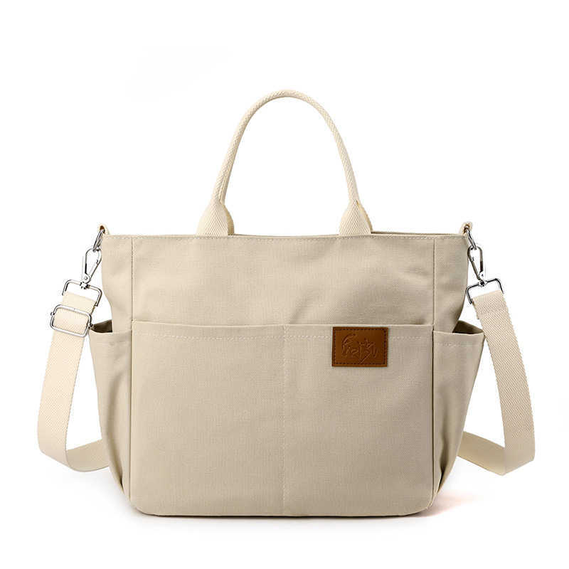 shoulder bag women's bag trend versatile, simple fashionable Korean version large capacity handheld college sail cloth bag 241215