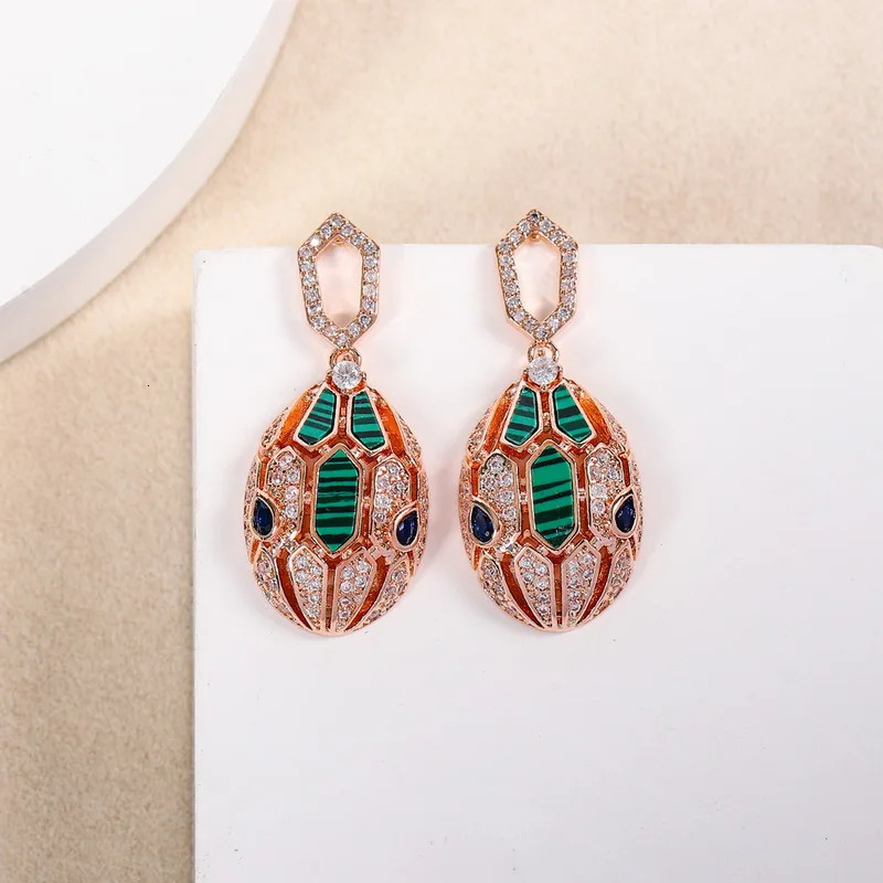 European and American er earrings for women set with cubic zirconia peacock stone gold-plated 925 silver needle snake earrings 241209