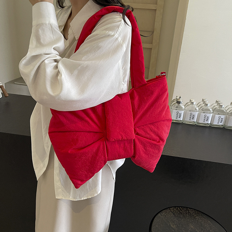 2025 new new minimalist canvas one shoulder bag, cute and exquisite bow tie, niche crossbody commuting tote bag zhanyishengli