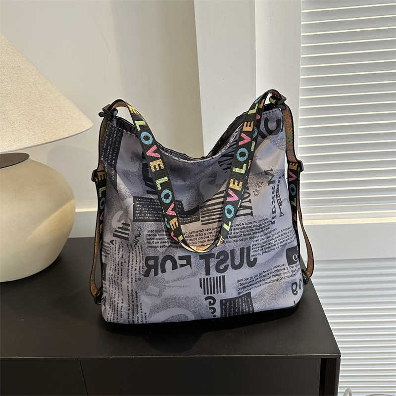 Printed trendy backpack with one shoulder two backpacks Korean version simple casual versatile armpit bag letter bag 241215