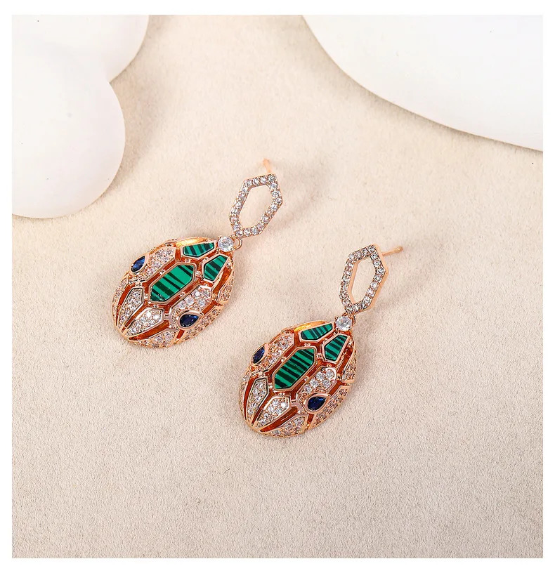 European and American er earrings for women set with cubic zirconia peacock stone gold-plated 925 silver needle snake earrings 241209