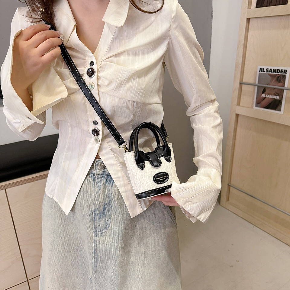 A new cute trend and exquisite soft trend designer PU handbag suitable for daily necessities such as lipstick phone buttons etc