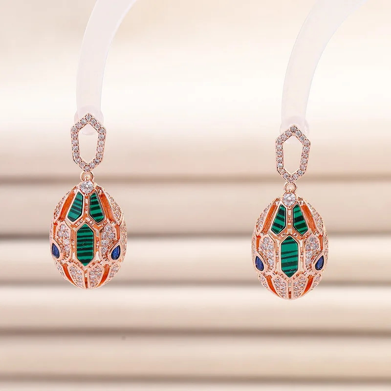 European and American er earrings for women set with cubic zirconia peacock stone gold-plated 925 silver needle snake earrings 241209