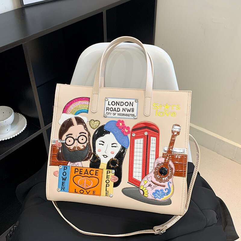 Small niche design women's embroidered fabric commuting handbag, one shoulder crossbody tote bag, 2024 new style, chic and elegant clothing